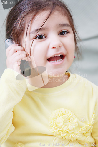 Image of Little girl on phone