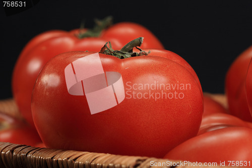 Image of Tomatoes in basket closeup