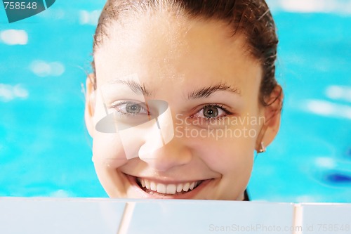 Image of Happy woman in pool