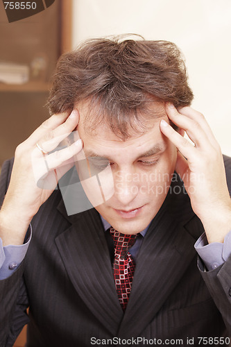 Image of Businessman lost in thoughts