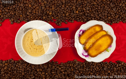 Image of coffee cup from above with coffee beans