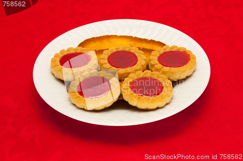 Image of plate of cookies on red background