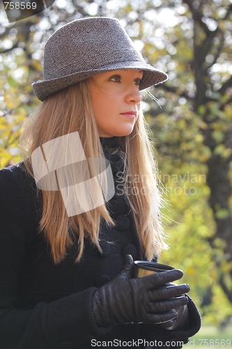 Image of Serious blonde in hat