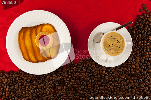 Image of coffee cup from above with coffee beans