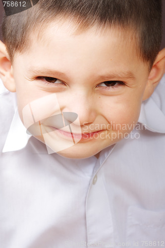 Image of Smiling boy in white shirt