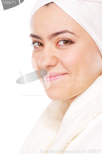 Image of Smiling woman in bathrobe sideview