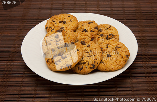 Image of plate of cookies on dark brown background