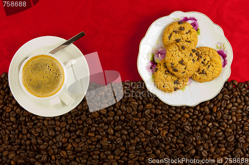 Image of coffee cup from above with coffee beans