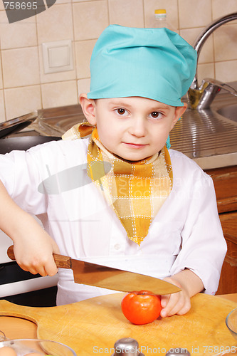 Image of Little cook with knife and tomato