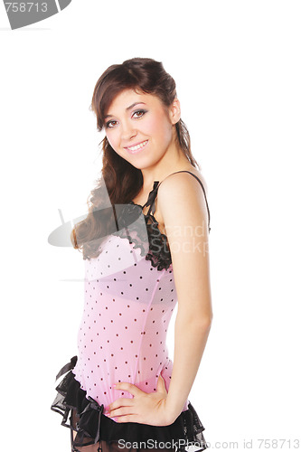 Image of Smiling woman in pink dress sideview