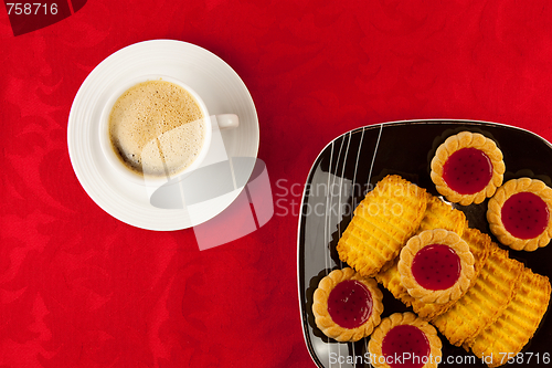 Image of Coffee and cookies on a red background