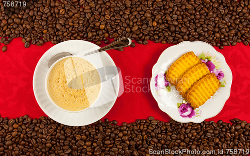 Image of coffee cup from above with coffee beans