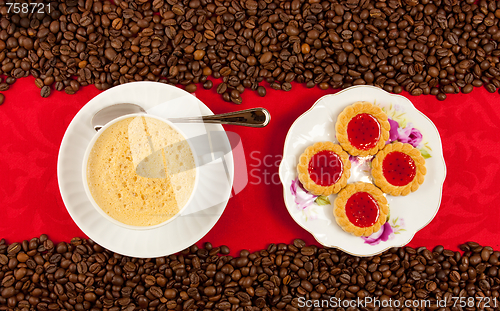 Image of coffee cup from above with coffee beans