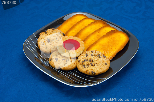 Image of cookies on a Plate on a blue background