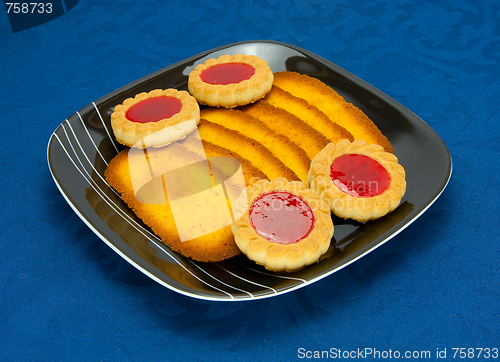 Image of cookies on a Plate on a blue background 