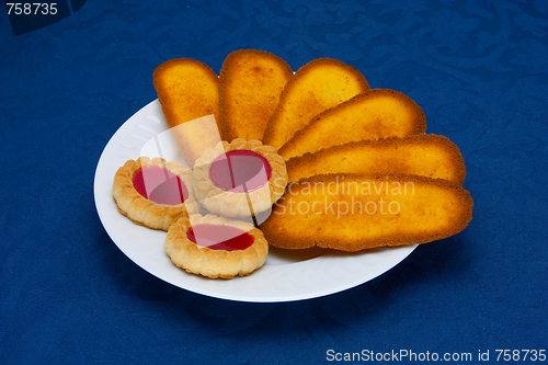 Image of cookies on a Plate on a blue background 