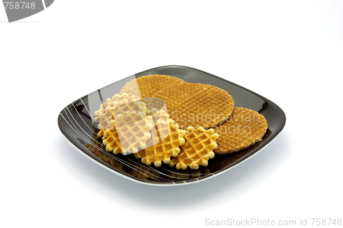 Image of cookies on plate isolated on white background