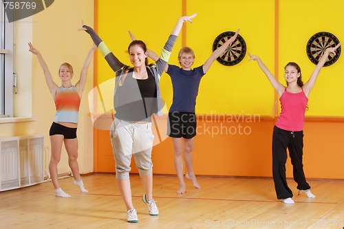 Image of Raising hands in group aerobics
