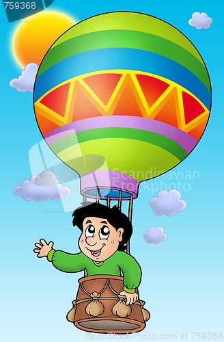 Image of Boy in balloon on sky