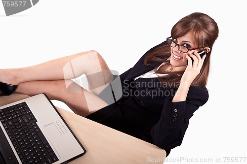 Image of Young attractive caucasian twenties businesswoman with laptop