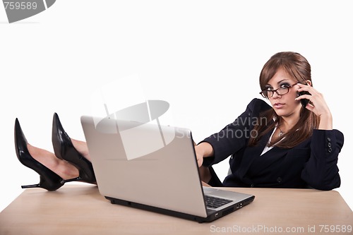 Image of Young attractive caucasian twenties businesswoman with laptop