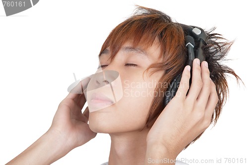 Image of Portrait of Korean teenager enjoying music