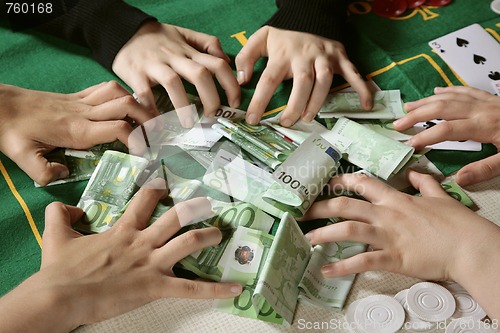 Image of Greedy hands grabbing cash