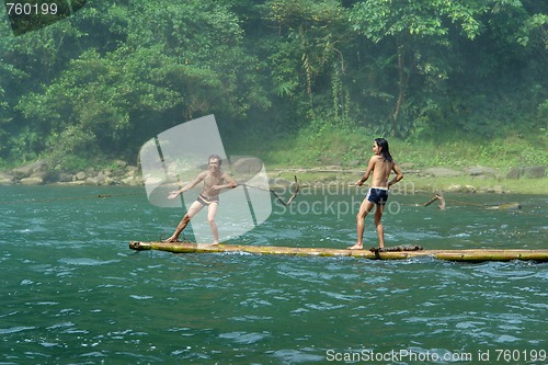 Image of Boys playing on tropical raft