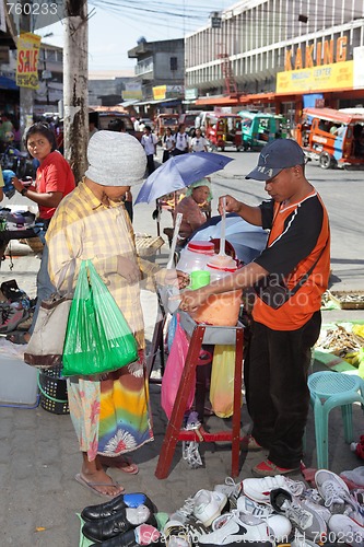 Image of Asian street vendor w customer