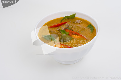 Image of red curry in a white bowl