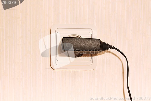 Image of wall plug with a cable