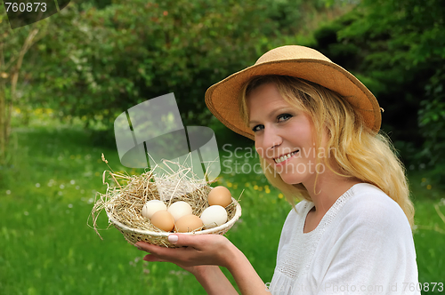 Image of Young woman and Easter eggs