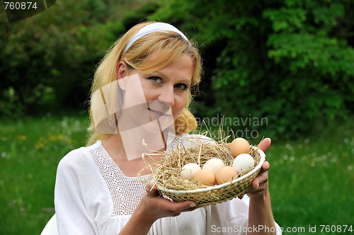 Image of Young woman and Easter eggs