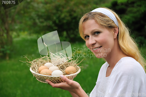Image of Young woman and Easter eggs