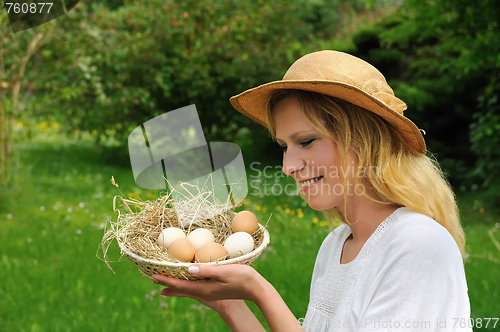 Image of Young woman and Easter eggs