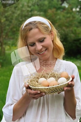 Image of Young woman and Easter eggs