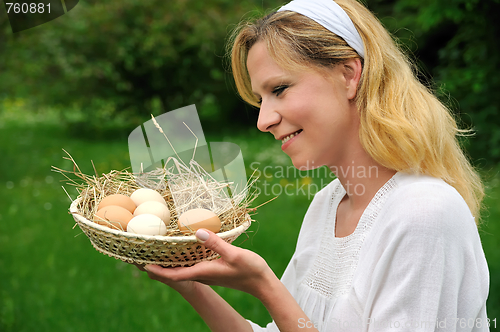 Image of Young woman and Easter eggs