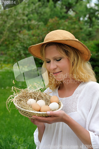 Image of Young woman and Easter eggs