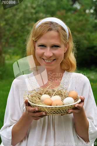 Image of Young woman and Easter eggs