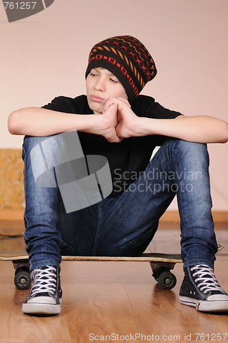 Image of The teenager with a skateboard 