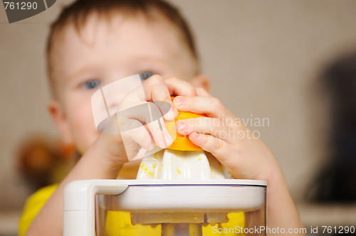 Image of The child to wring out juice