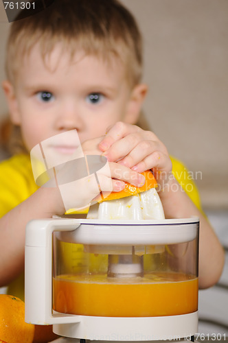 Image of The child to wring out juice