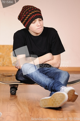 Image of The teenager with a skateboard 