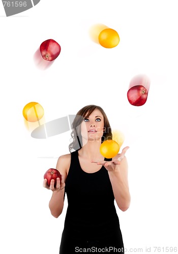 Image of Beautiful woman juggling apples and oranges on a white backgroun