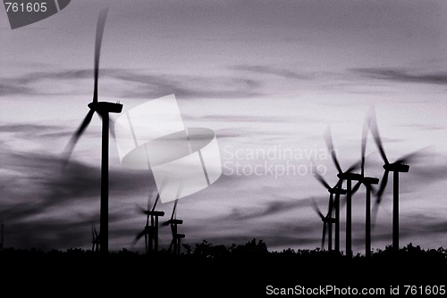 Image of Warm tone black and white image of wind power turbines