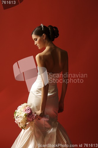 Image of Bride Turned Toward Red Wall Looking Down