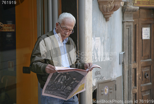 Image of Man reading newspaper