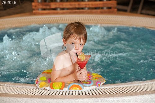 Image of Boy with glass of coctail