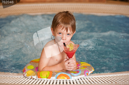 Image of Boy with glass of coctail