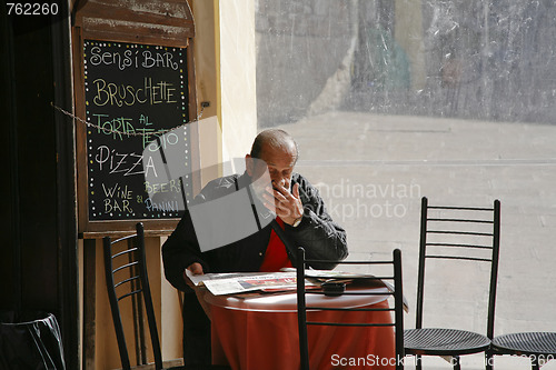 Image of Senior reading newspaper